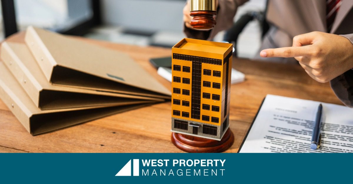 a man next to a model of a building