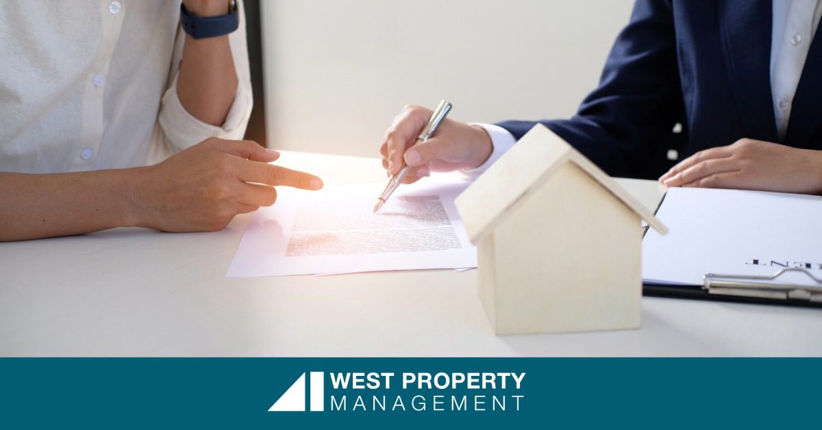 Two people writing a guide to Homeowners Association Management.